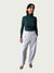 Model in Ribbed Mock Neck Shirttail Top in Silver Pine with long sleeves and a close, body-skimming fit, styled with the Organic Contoured Cotton Arc Pant in Porcelain.