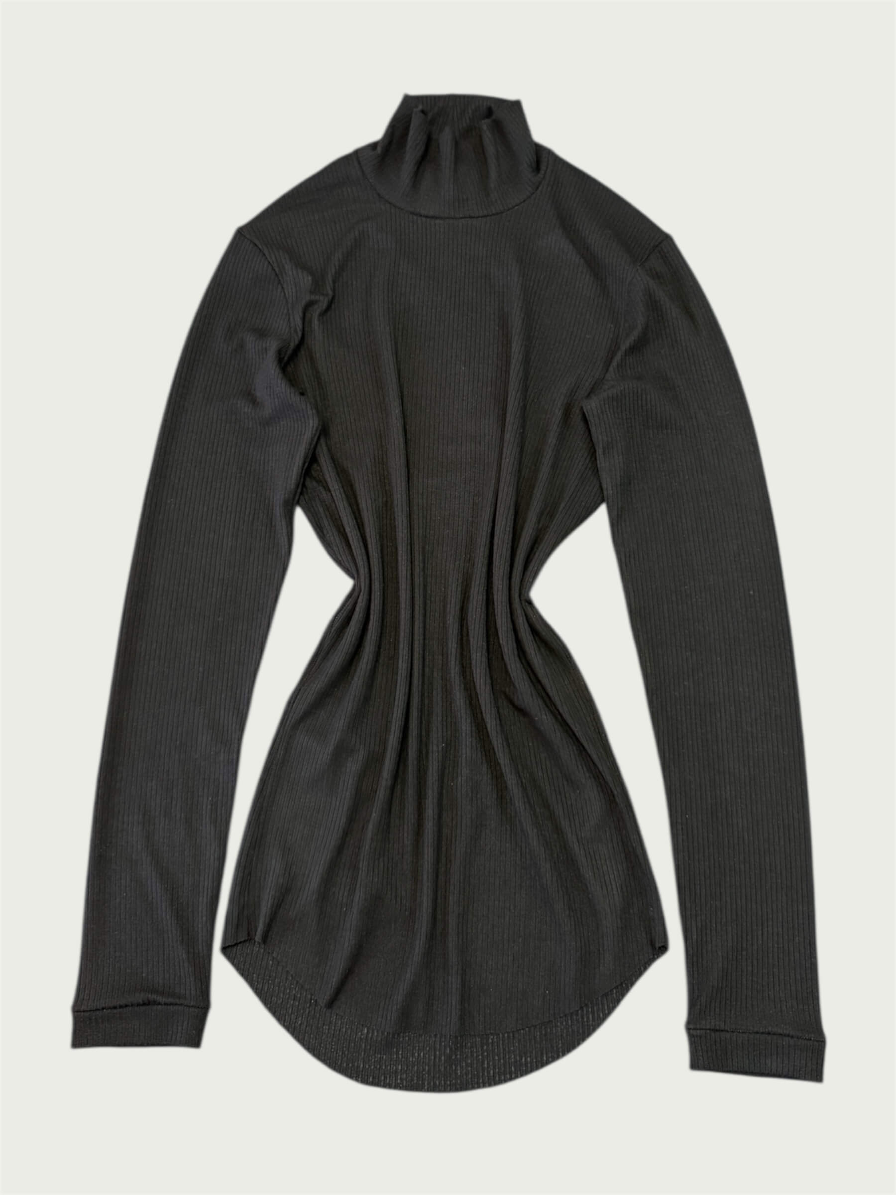 Flat lay of Ribbed Mock Neck Shirttail Top in Black, featuring its rounded shirttail hem.
