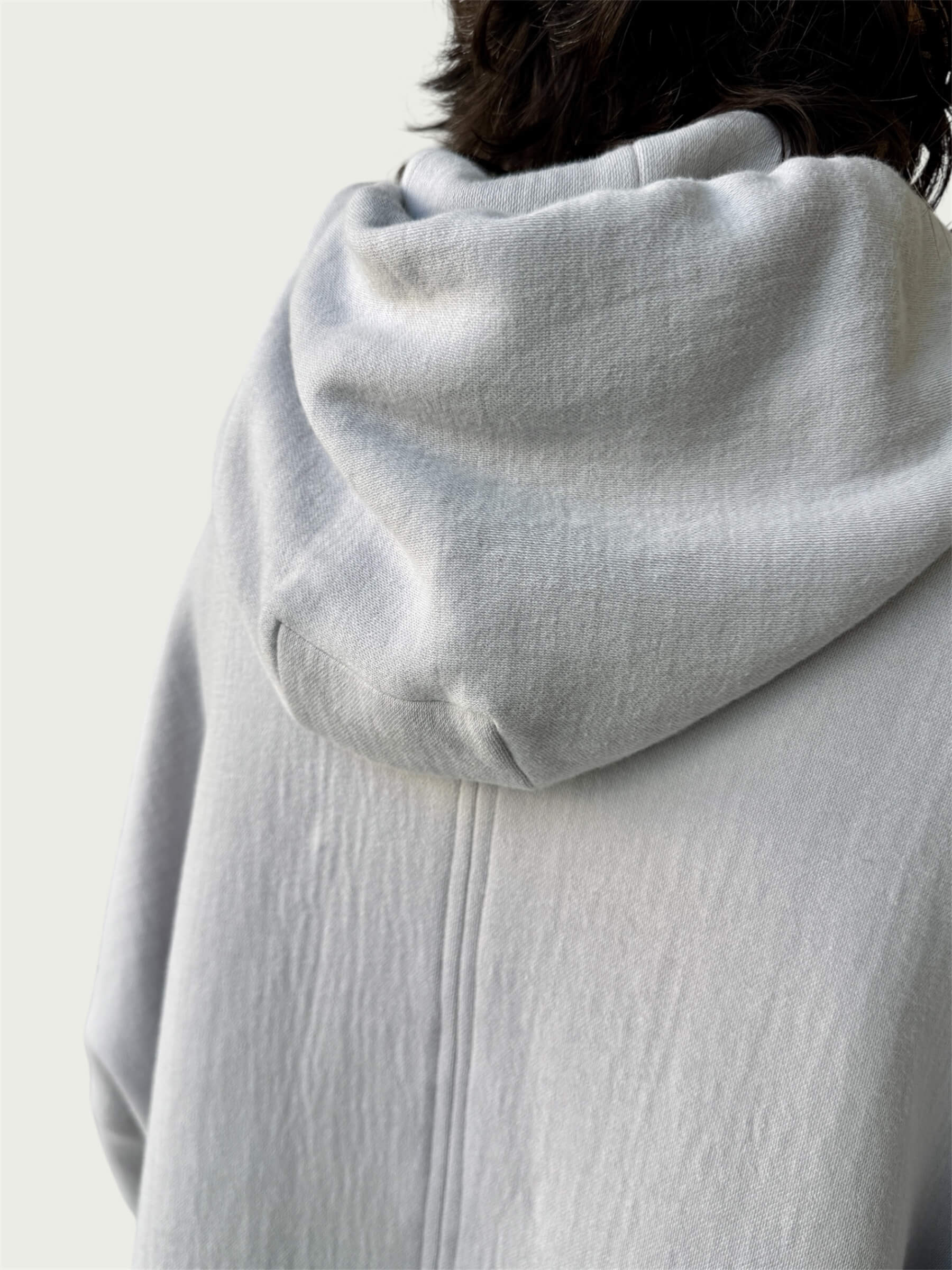 Rear view of double layered hood on Organic Contoured Cotton A.D.C. Hoodie in Porcelain.