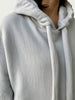 Detail of double layered hood with a thick drawstring on Organic Contoured Cotton A.D.C. Hoodie in Porcelain.