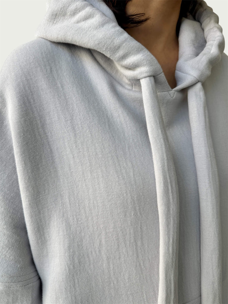 Detail of double layered hood with a thick drawstring on Organic Contoured Cotton A.D.C. Hoodie in Porcelain.