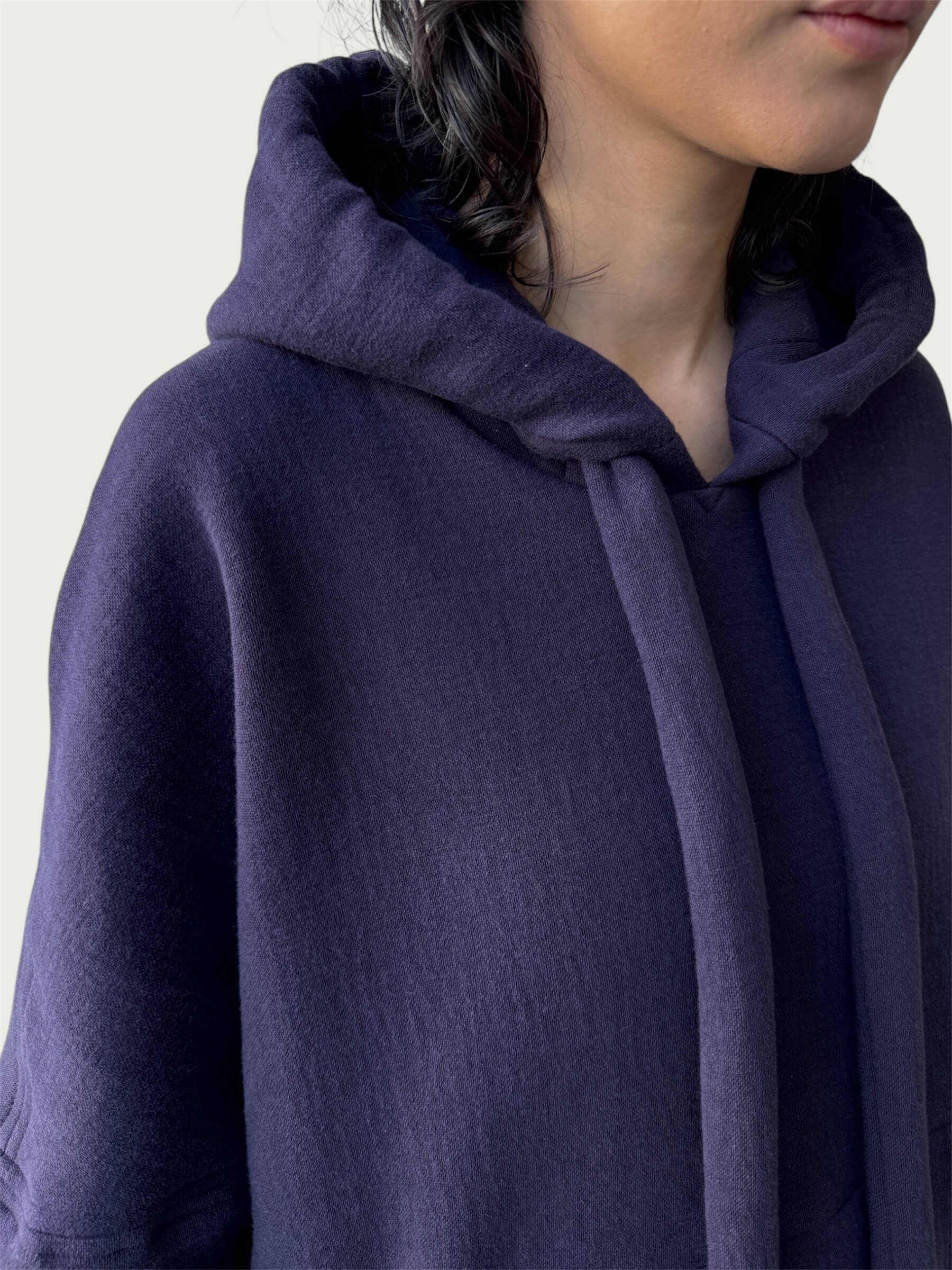 Detail of double layered hood with a thick drawstring on Organic Contoured Cotton A.D.C. Hoodie in Evening Violet.