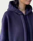 Detail of double layered hood with a thick drawstring on Organic Contoured Cotton A.D.C. Hoodie in Evening Violet.