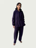 Model in Organic Contoured Cotton A.D.C. Hoodie in Evening Violet with in-seam Kangaroo pocket and double layered hood, styled with Organic Contoured Cotton Arc Pant in Evening Violet.