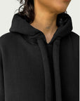 Detail of double layered hood with a thick drawstring on Organic Contoured Cotton A.D.C. Hoodie in Black.