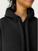 Detail of double layered hood with a thick drawstring on Organic Contoured Cotton A.D.C. Hoodie in Black.