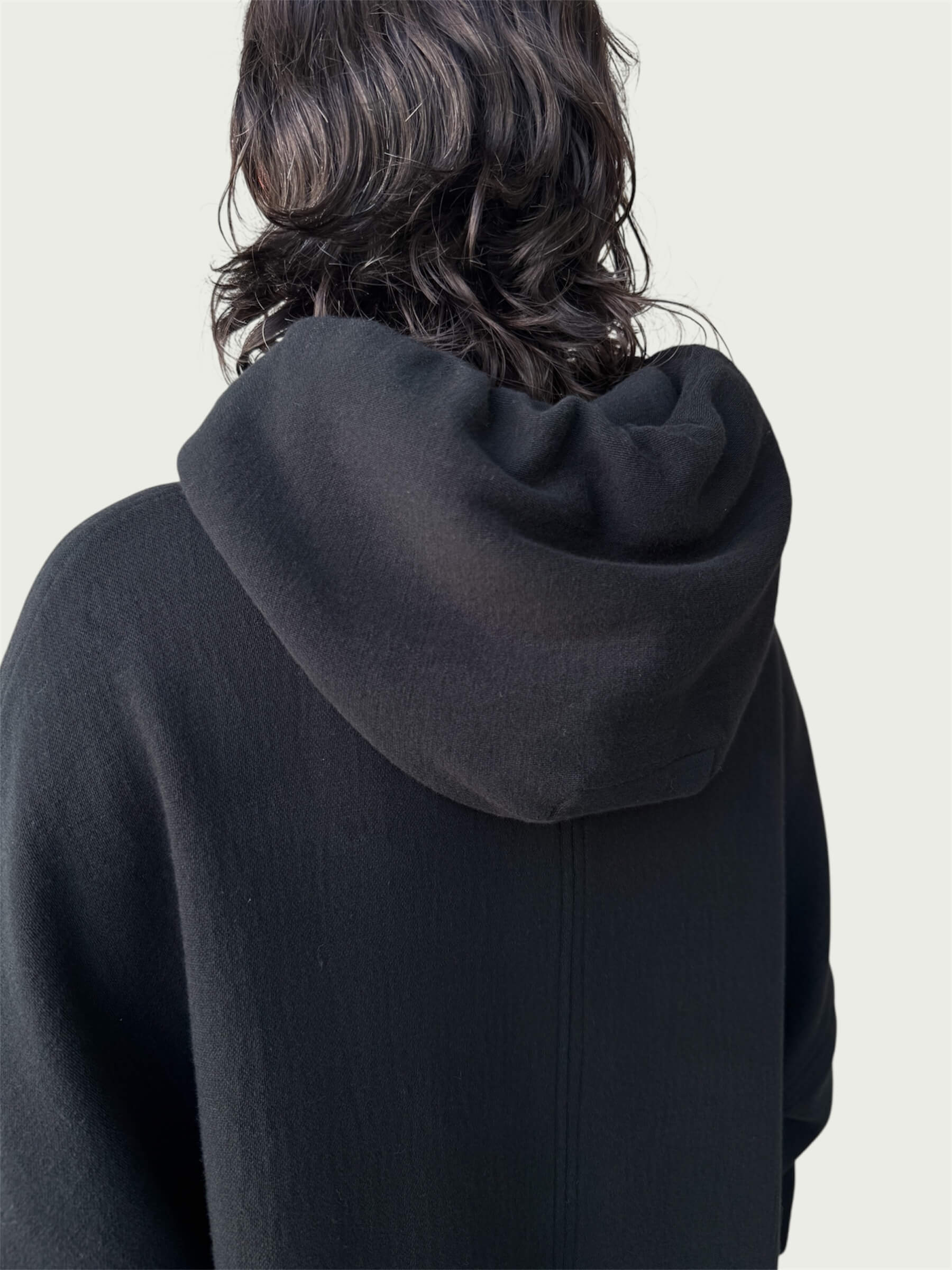 Rear view of double layered hood on Organic Contoured Cotton A.D.C. Hoodie in Black.